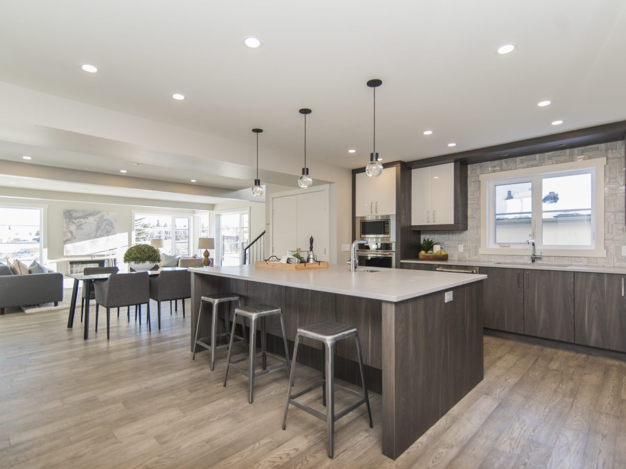 A beautiful shot of a modern house kitchen and dining room